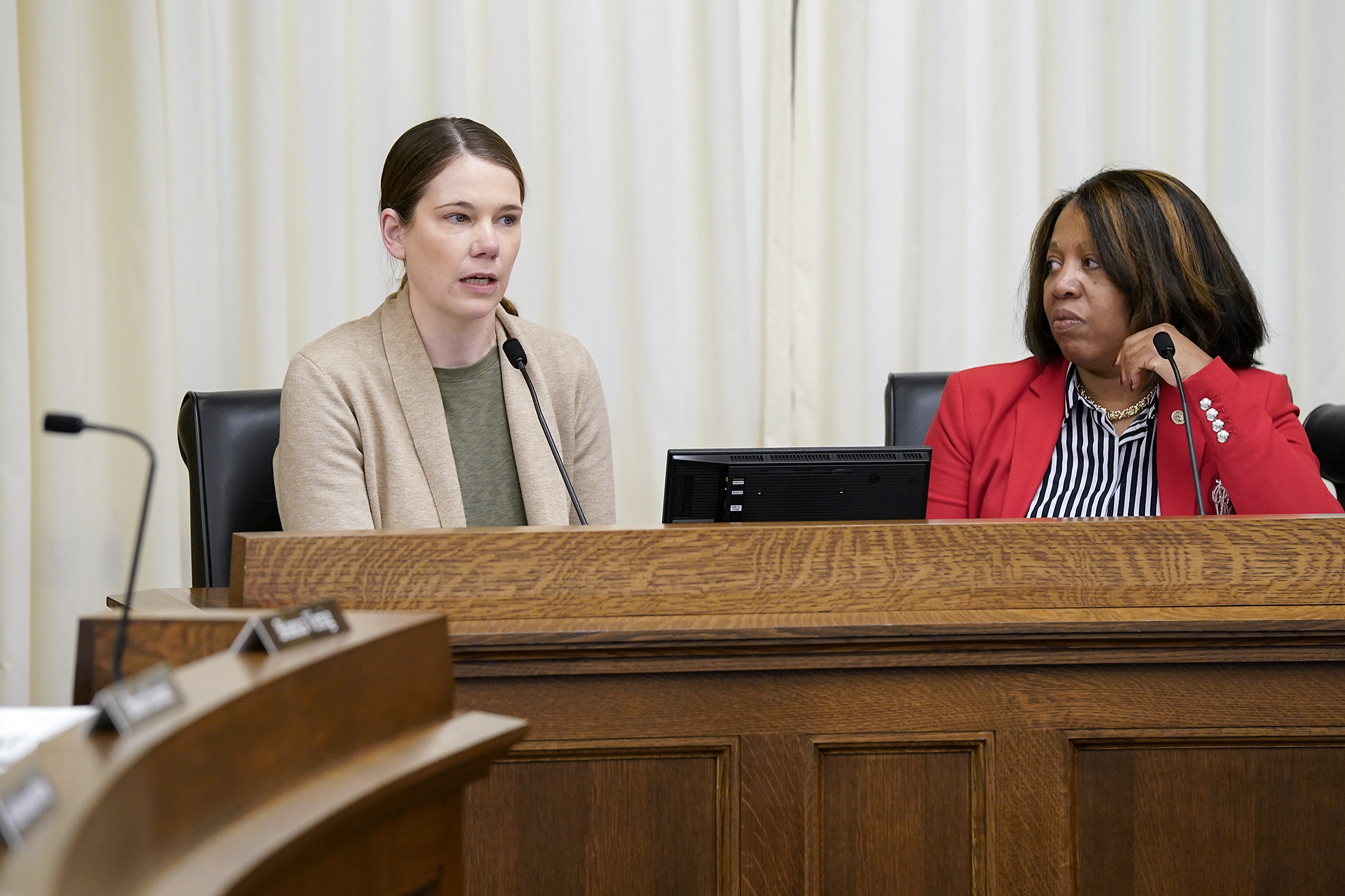 Sara Grafstrom, senior director of state and federal policy for ARRM, testifies March 5 for HF1215. Rep. Mary Frances Clardy, right, sponsors the bill that would modify home and community-based services licensing actions. (Photo by Michele Jokinen)